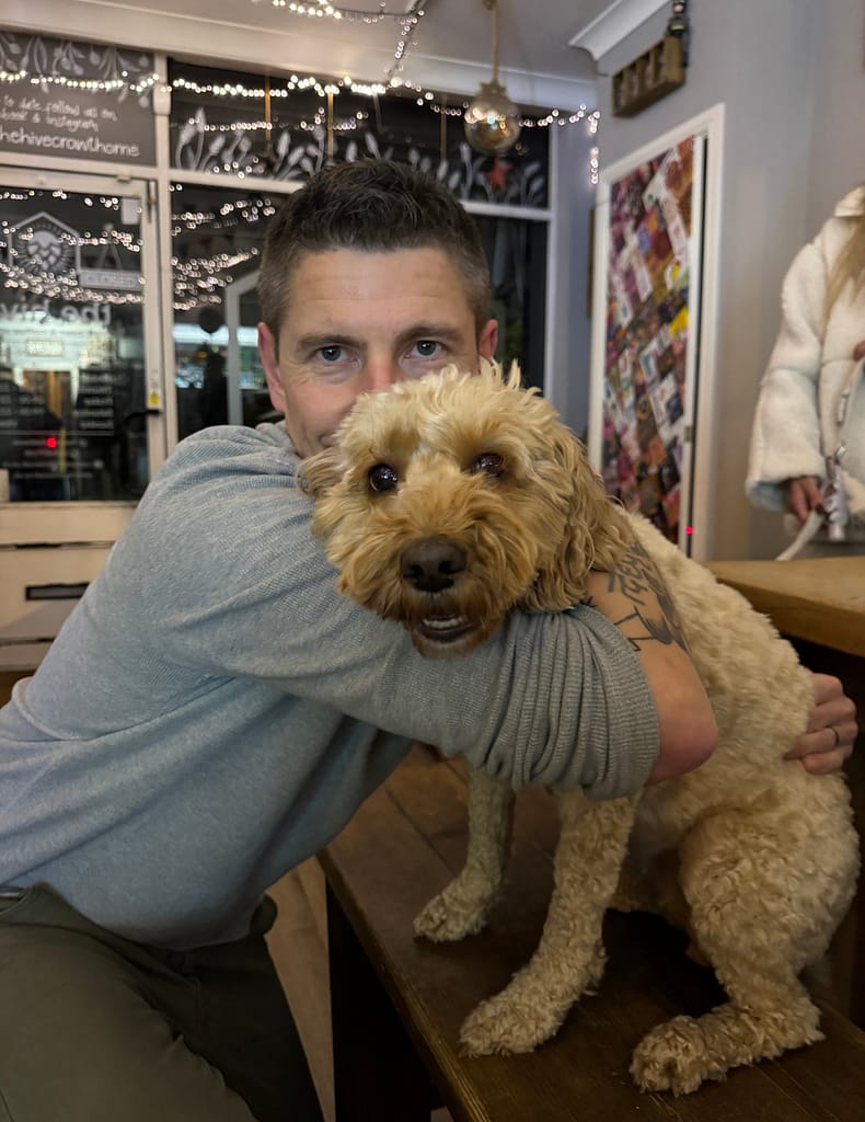 alex cuddling dog